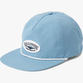 Light blue Billabong trucker cap with perforated mesh back, a flat brim, and a white oval logo patch on the front.