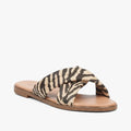 Butterfly Womens Indi 1 flat sandal featuring stylish black and tan zebra print criss-cross straps on a comfortable tan