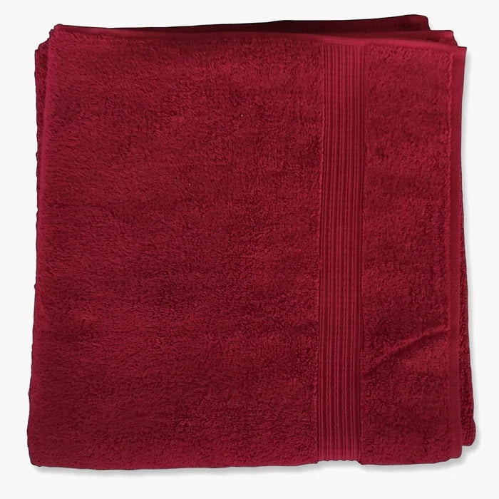 Folded scarlet red Colibri Imperial Zerotwist Bath Sheet made from absorbent terry cloth material.