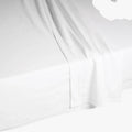 White Cotton Co 400 thread count fitted queen sheet on a mattress, highlighting the fabric and fit.