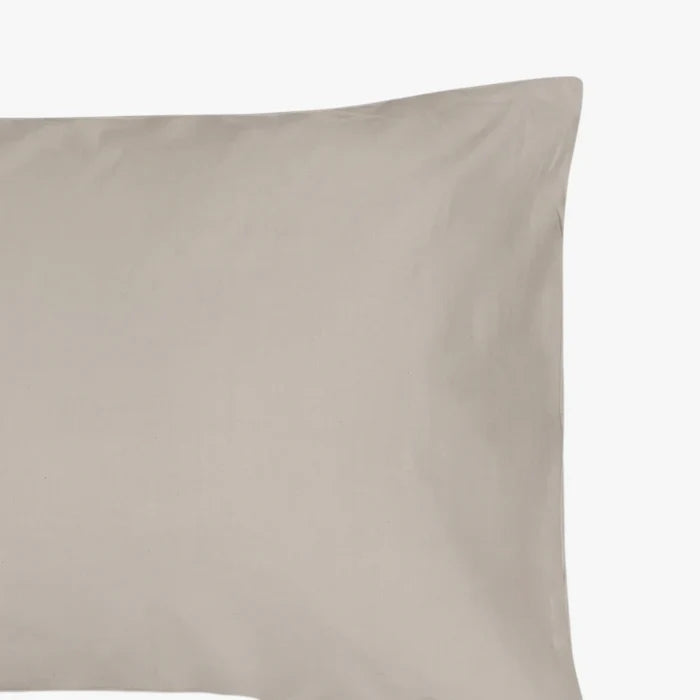 Close-up of a single Cotton Co 400 Thread Oxford pillowcase in a soft stone color, showcasing its smooth fabric texture.