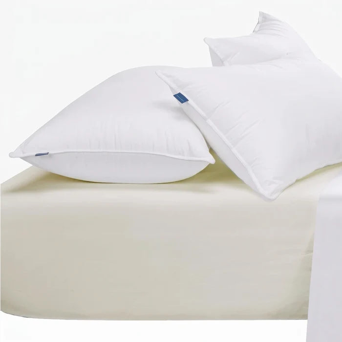 Cream Cotton Co 400 thread count Queen extra fitted sheet with two white pillows, for comfortable bedding.