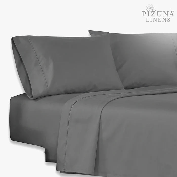 Grey Cotton Co 400 thread count queen flat sheet shown on a bed with pillows, highlighting its smooth texture.