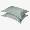 Pair of Cotton Co. 400 Thread Oxford Standard Pillow Cases in a soft duck egg blue color, stacked neatly, for bedding and