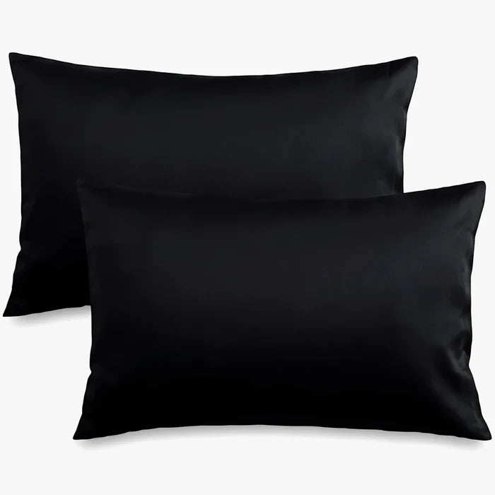 Two black Cotton Co. 400 thread count standard pillowcases, size 45x70, arranged on a surface.