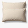 Cream cotton pillowcase from Cotton Co, a standard 45x70 size, shown unfolded and flat on a white background.