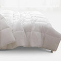 White Cotton Co Hotel Collection Luxury Micro Fibre 3/4 Duvet Inner with quilted box stitching on a bed.