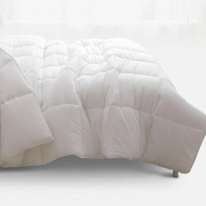 White Cotton Co Hotel Collection Luxury Micro Fibre 3/4 Duvet Inner with quilted box stitching on a bed.