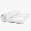 Cotton Co Luxury 100% Cotton Super King Inner, white and partially rolled, showcasing its soft quilted texture.
