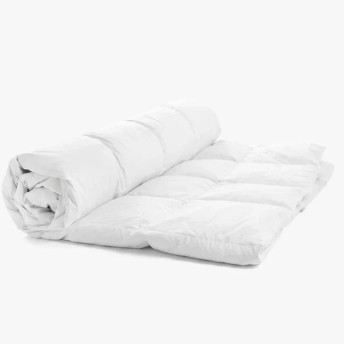 Cotton Co Luxury 100% Cotton Super King Inner, white and partially rolled, showcasing its soft quilted texture.