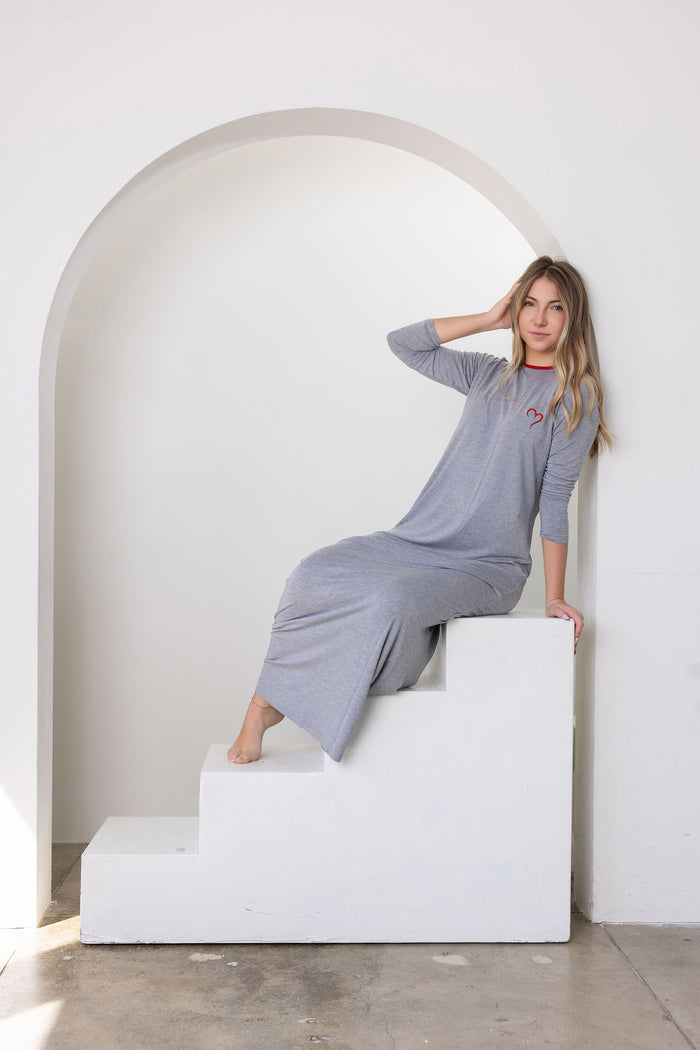 Gray long-sleeve heart lounge nightgown with loose wide-leg pants, arm raised