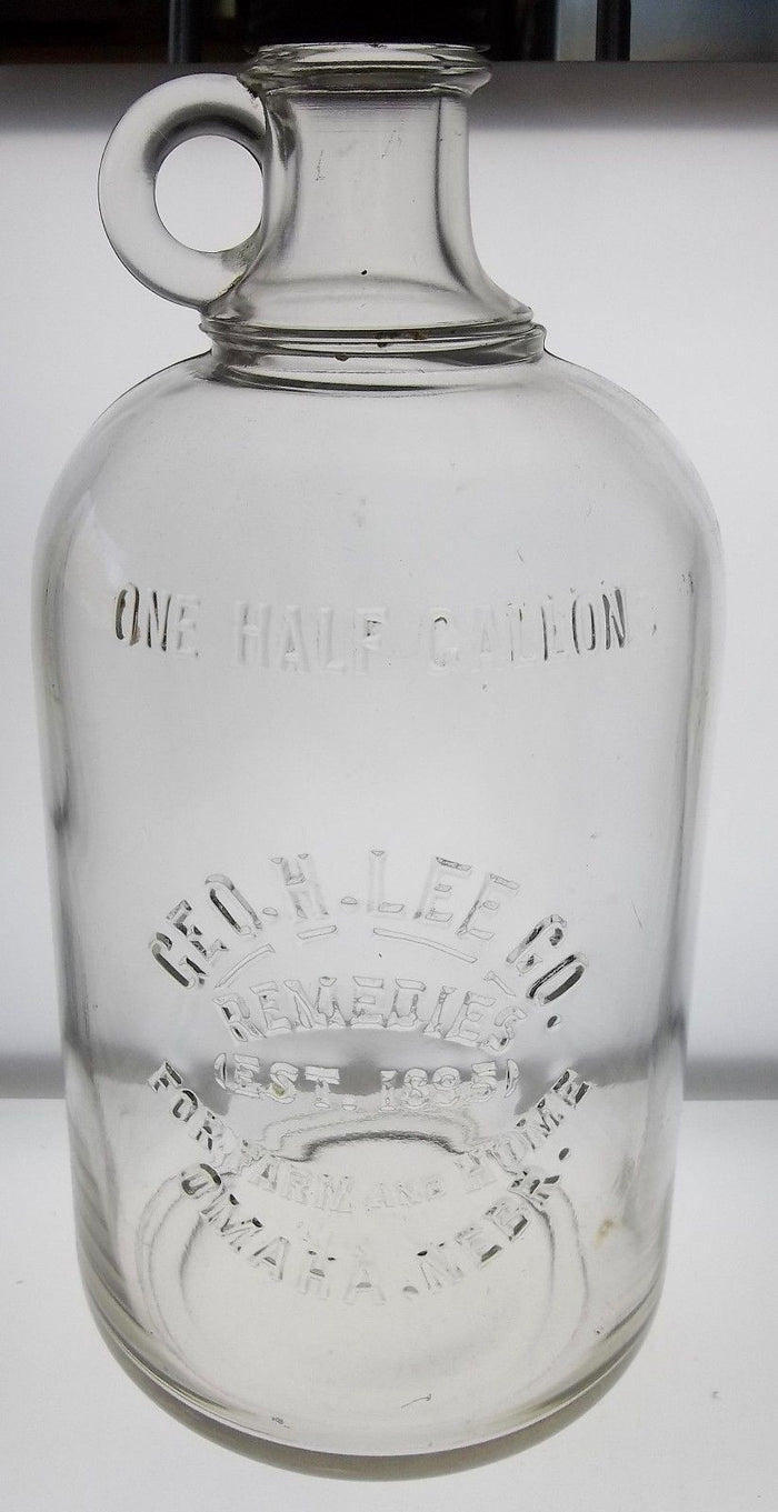 Geo.H.Lee Co. Remedies Glass Jug