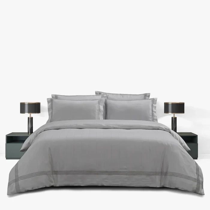 Giorgio Queen Duvet Cover T400 in cream/stone, featuring matching pillow shams, neatly arranged on a bed.