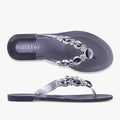 Pair of Holster Womens Embellish Sandals in clear midnight blue, featuring decorative silver and dark gemstone