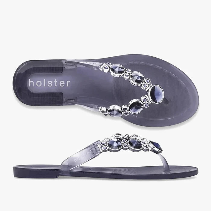 Pair of Holster Womens Embellish Sandals in clear midnight blue, featuring decorative silver and dark gemstone
