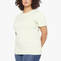 Jeep Ladies Essential Logo Short Sleeve Tee in Aloe Gel, shown on a woman from the waist up. This soft, light green t-shirt