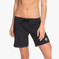 Roxy Ladies To Dye 7' Fixed Boardshort in anthracite, featuring a drawstring waist and logo detail, modeled from the front.