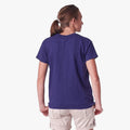 Woman wearing a Salomon Girls Time Will Tell Short Sleeve Tee in Astral Aura purple, viewed from the back, with beige shorts.