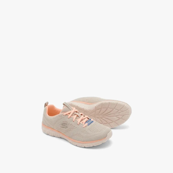 A pair of Skechers Women's Sport Active sneakers in taupe with pink accents and a mesh upper, viewed from a slightly