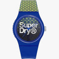 Superdry Urban Blue Silicone Strap Watch featuring a blue case, patterned watch face, and a vibrant geometric design on the