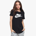 A woman wears a black Nike Womens Essential Icon Short Sleeve Tee with a white logo, paired with grey sweatpants.