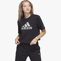 Black adidas Womens Icon Crop Tee with a patterned white logo, worn by a female model and paired with black sweatpants.